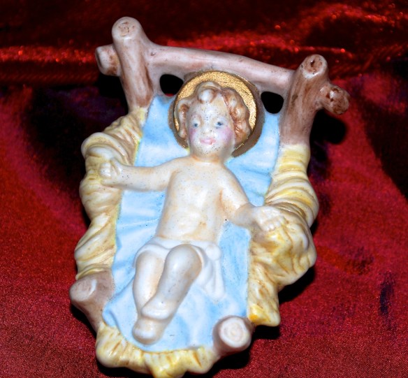 The baby Jesus is often depicted with a gold halo to signify his holiness.